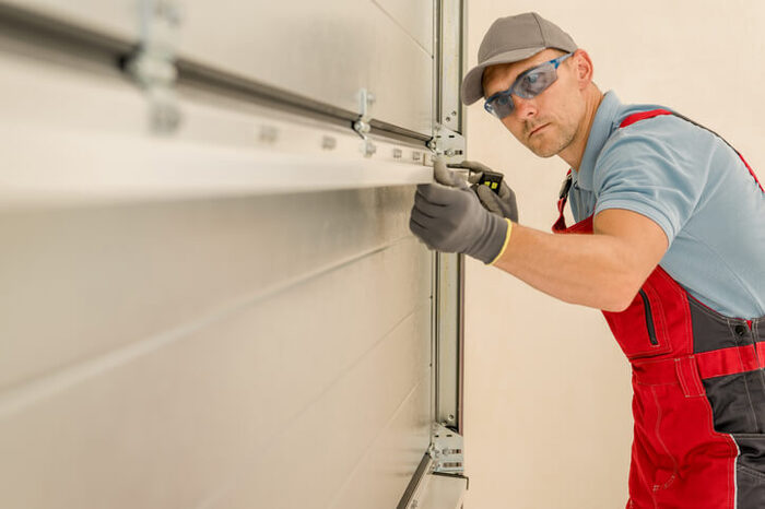 tradie installing garage door